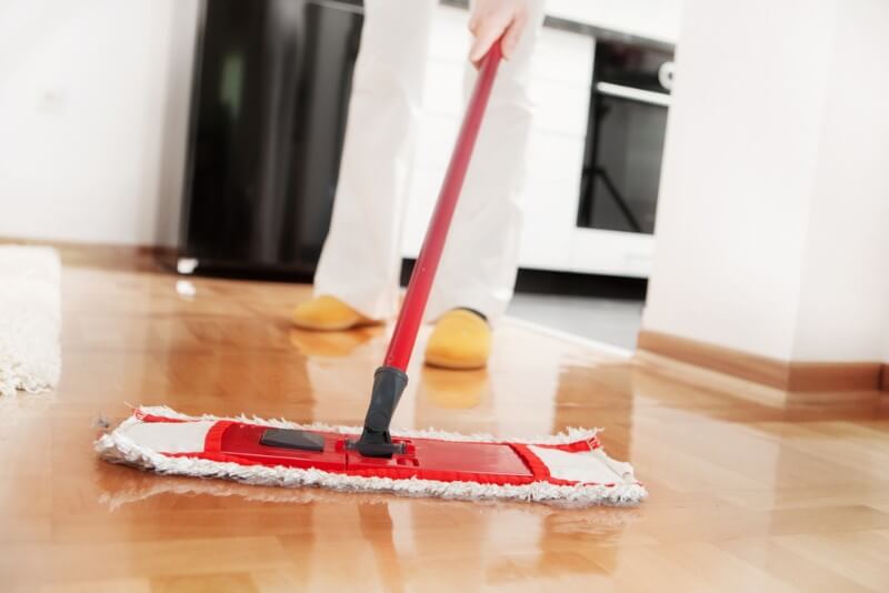 A person mopping the floor